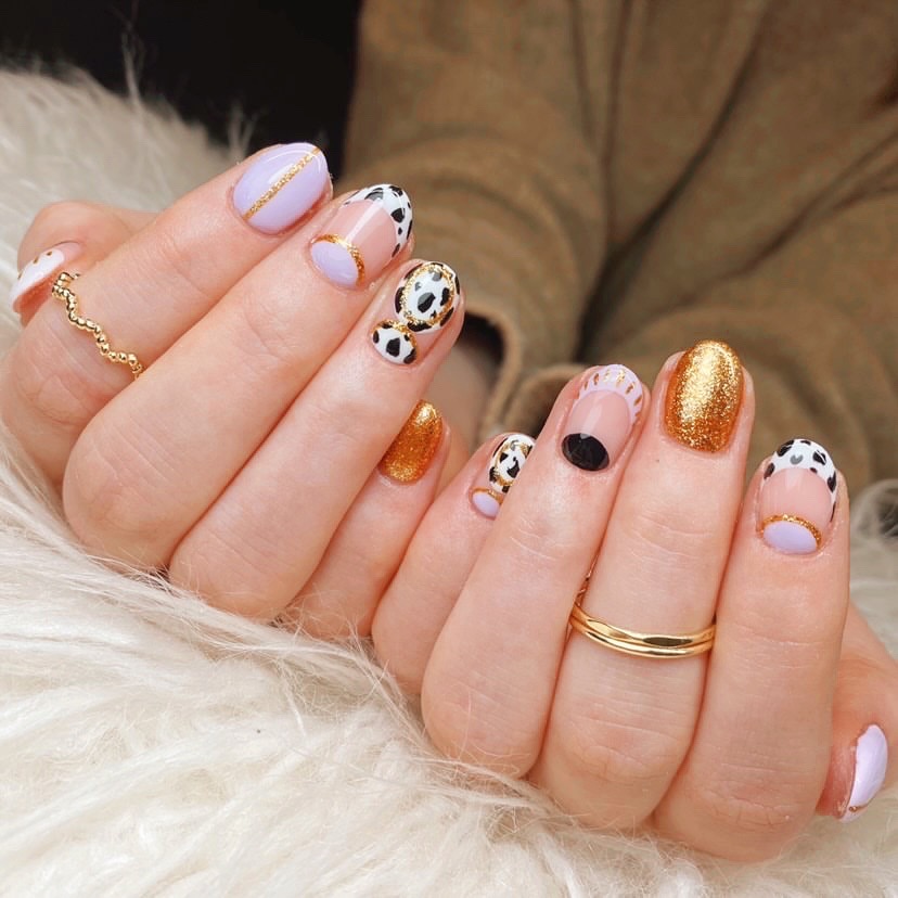 Cow print, but make it Christmas' festive manicure with Nails at